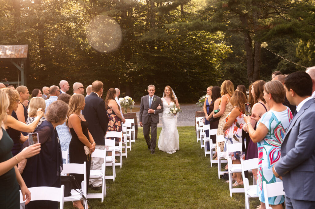 The bride's dad walking her down the aisle at Juniper Springs Wedding Barn.