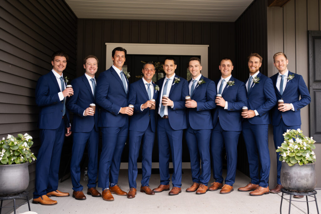 The groomsmen having a drink before the wedding.