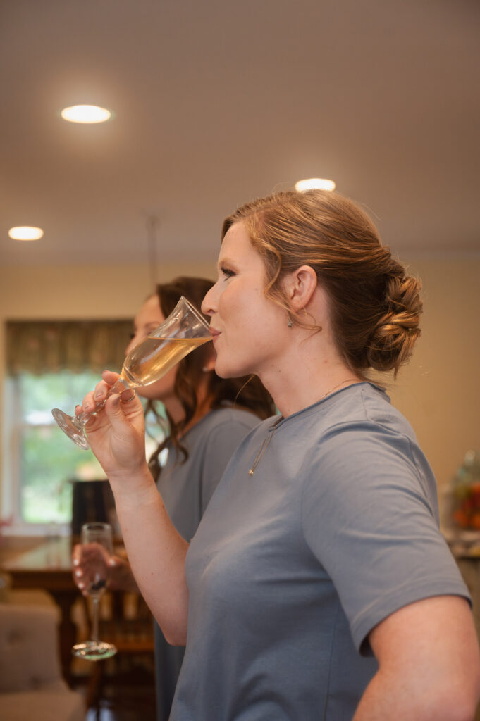 Bridesmaids getting ready before Leah & Brian's September wedding at Juniper Springs Wedding Barn.