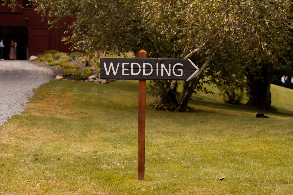 A sign directing guests to the ceremony location.