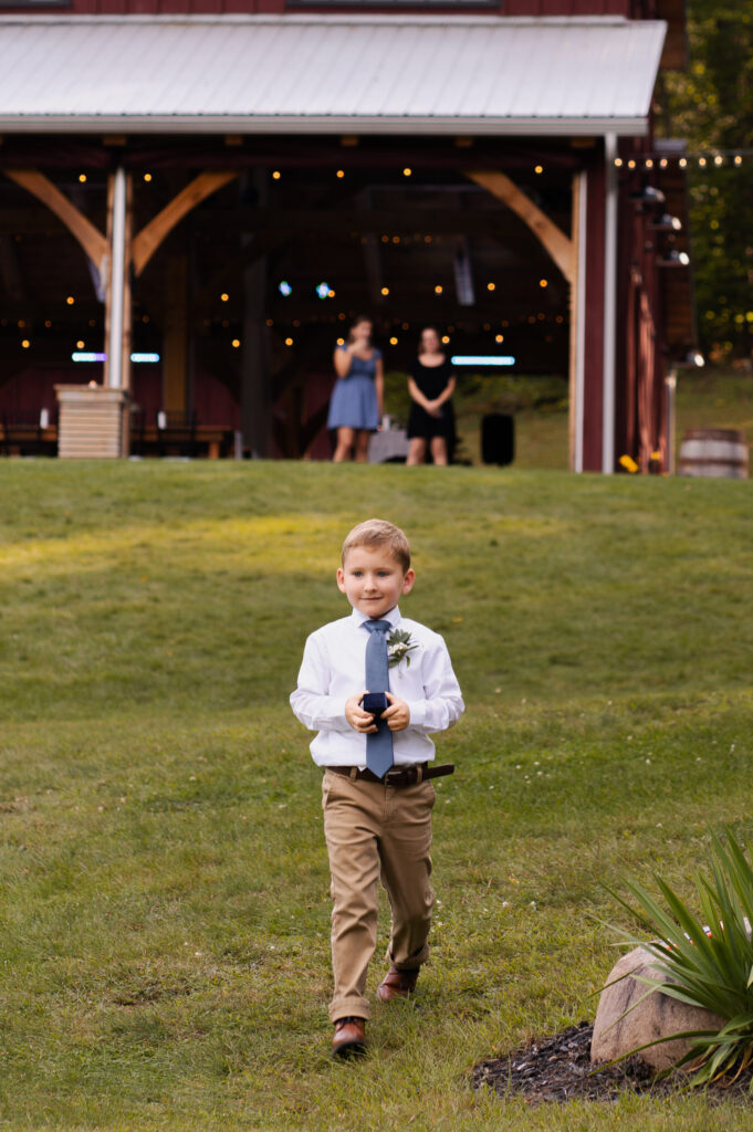 The ring bearer getting ready to walk down the aisle.