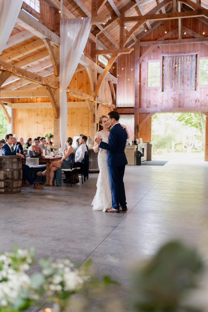 The bride and groom's first dance at Juniper Springs Wedding Barn.