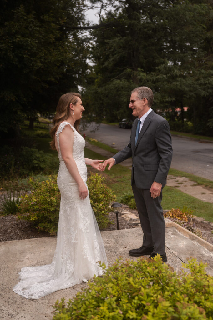 Leah and her dad sharing a private moment before her wedding.