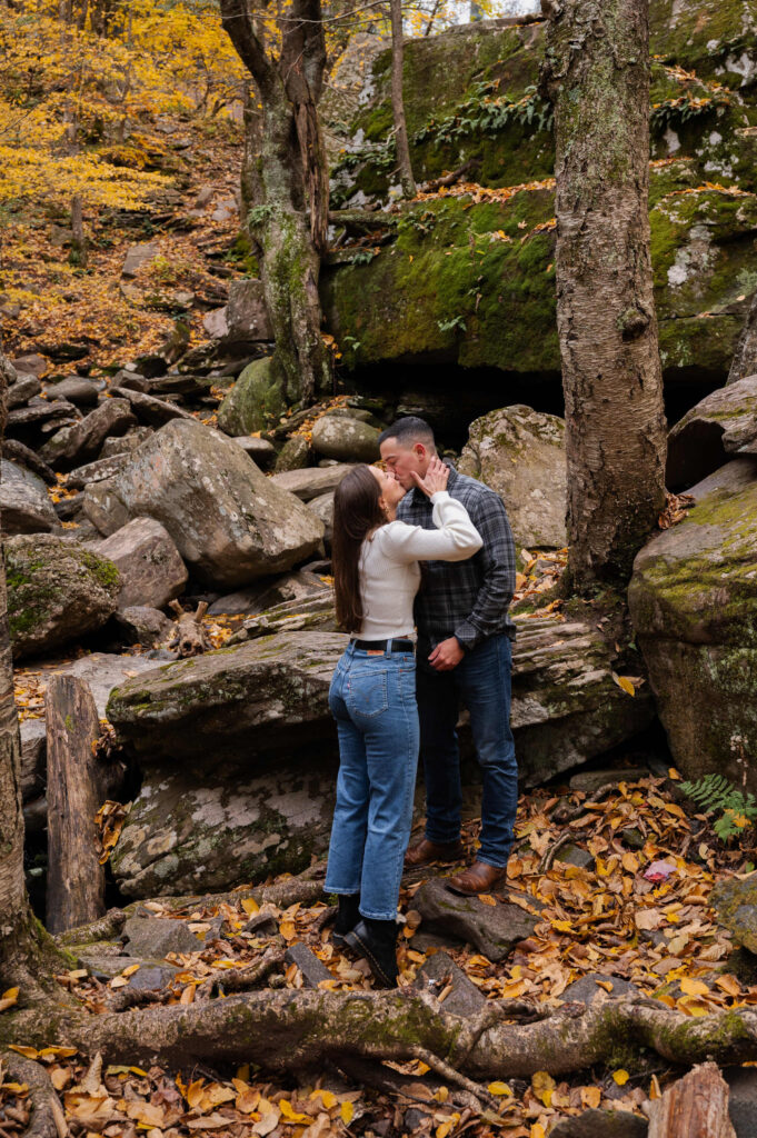 Aubrie going in for a kiss during their engagement session in the Catskill Mountains.