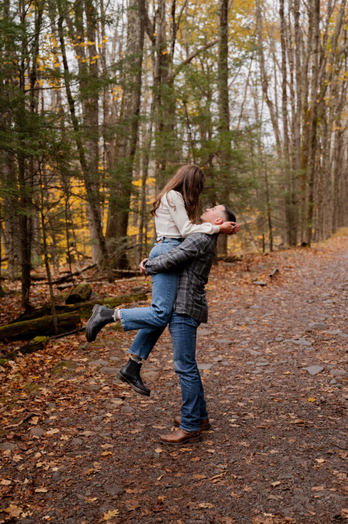 Catskills Wedding Photographer - Dolan lifting Aubrie up near Kaaterskill Falls during their engagement session in the Catskill Mountains.