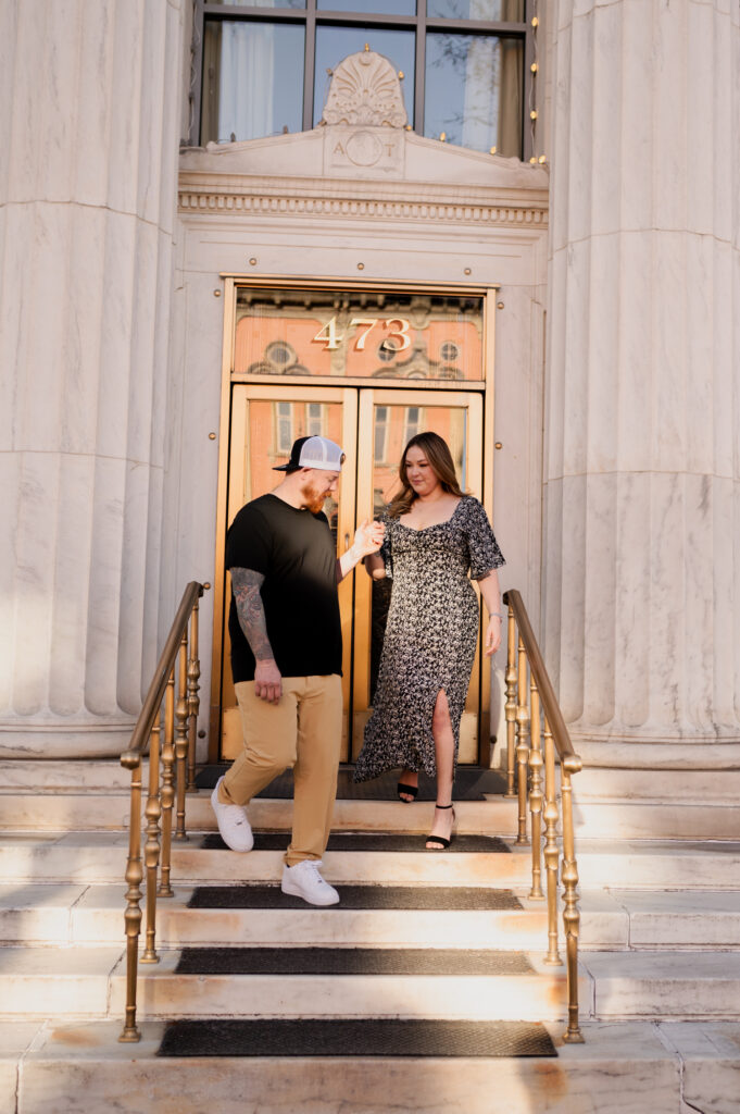 Walking the bride to be down the steps of Adirondack Trust in downtown Saratoga Springs during their engagement photos with Austin Ryan Photo.