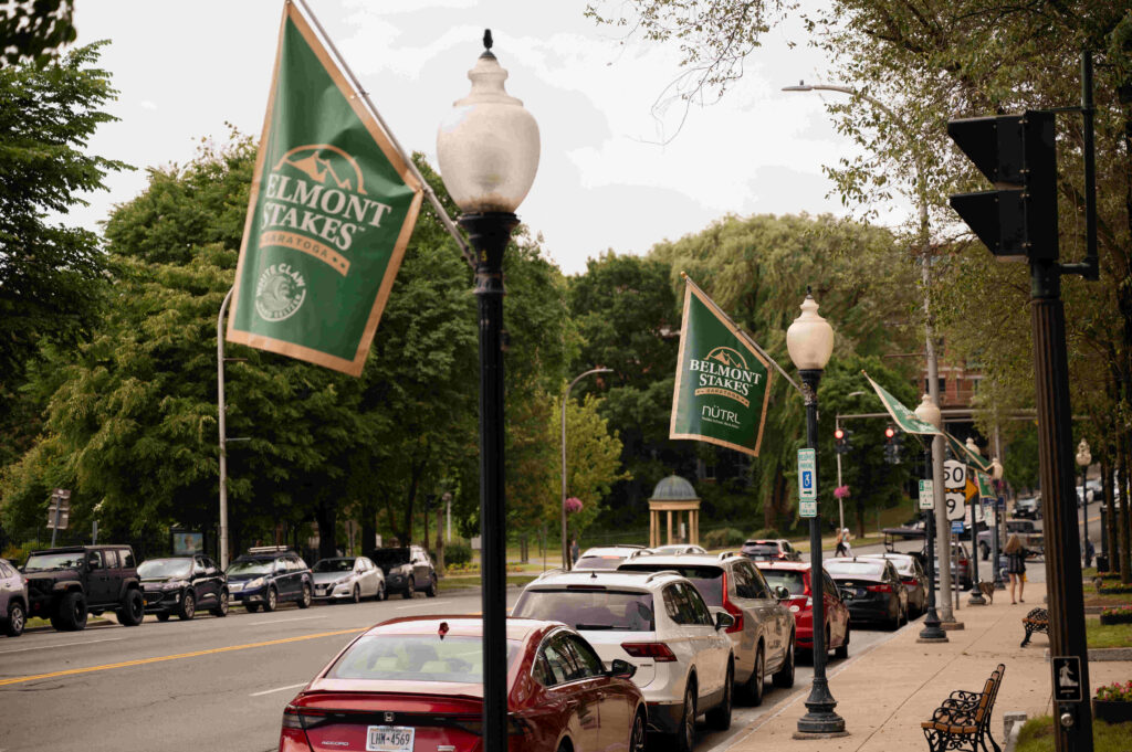 Banners hang from flag poles to celebrate the first Belmont Stakes in Saratoga Springs, New York.