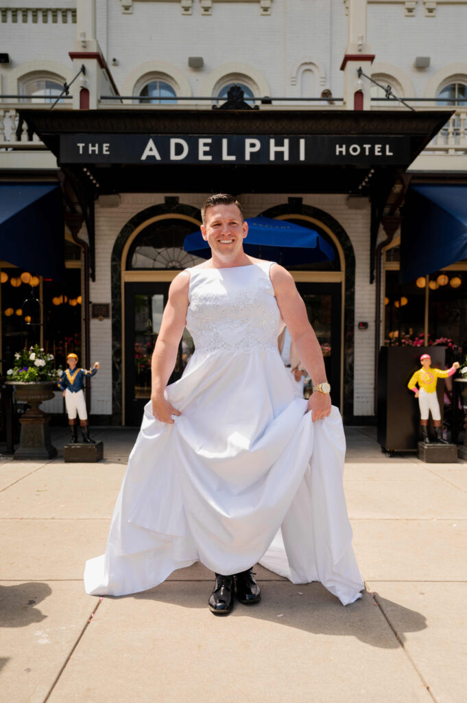 The Best Man on his way to do a fake first look with the groom outside of The Adelphi Hotel.