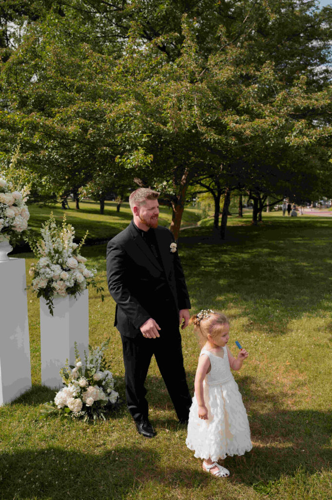 The groom and his daughter waiting for mom to make her way down the aisle.