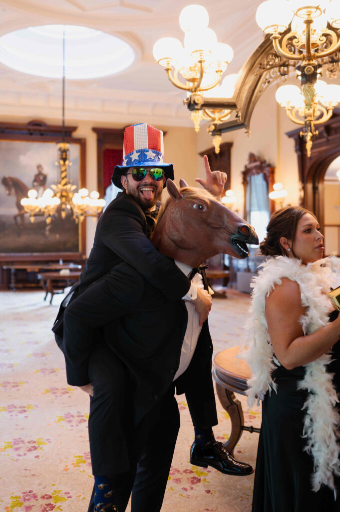 The bridal party preparing to make their entrance into the ballroom of the Canfield Casino during a wedding in Saratoga Springs, New York.