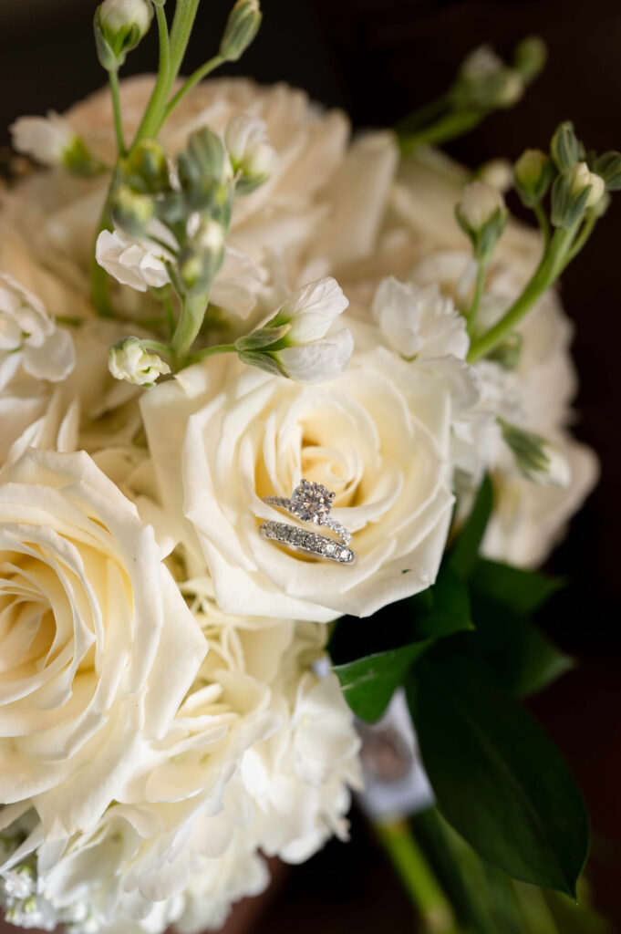 A detail shot of the bride's rings in her bridal bouquet at The Adelphi Hotel.