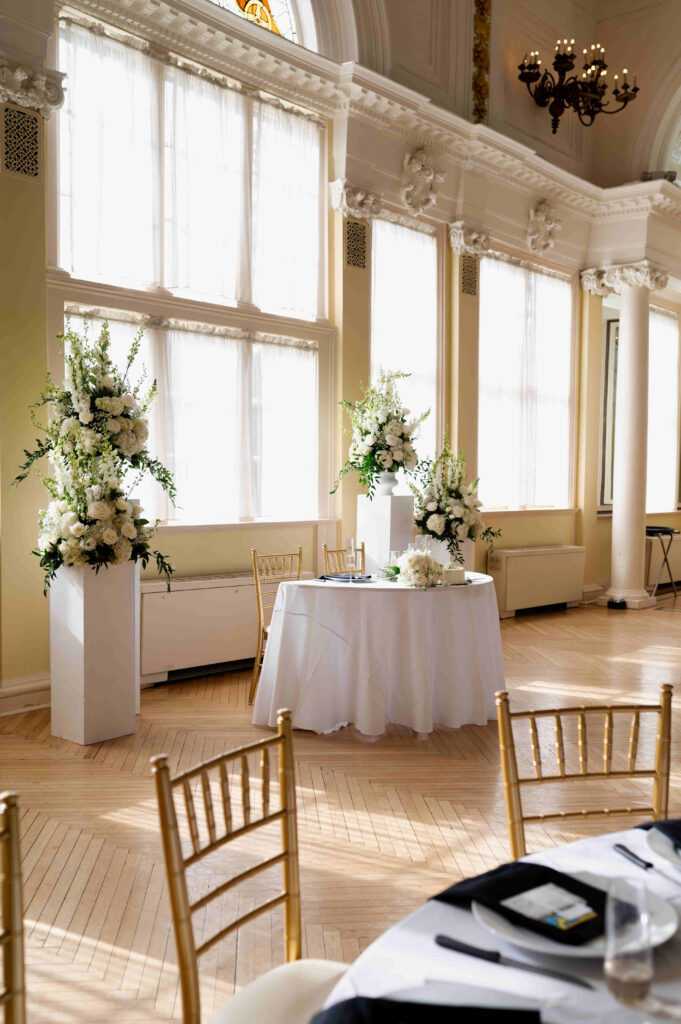 A photo of the sweetheart table set up inside of the Canfield Casino ballroom during a wedding in Saratoga Springs, New York.