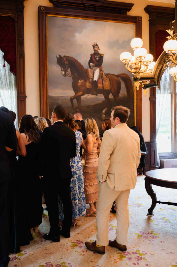 Guests watching the Belmont Stakes in the parlor at the Canfield Casino in Saratoga Springs, New York.