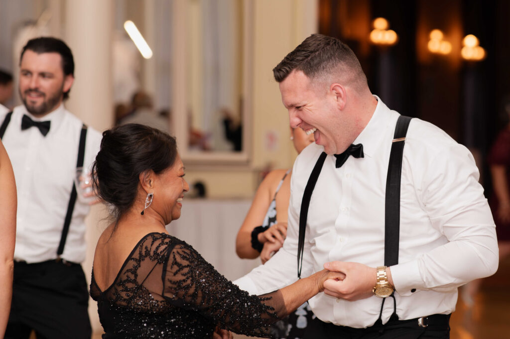 The bride and groom's family sharing a dance at their Canfield Casino wedding in Saratoga Springs, New York.