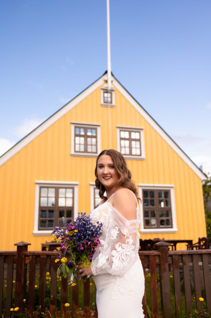 A portrait of the bride during her Iceland destination wedding just outside of our Airbnb in Ísafjörður.